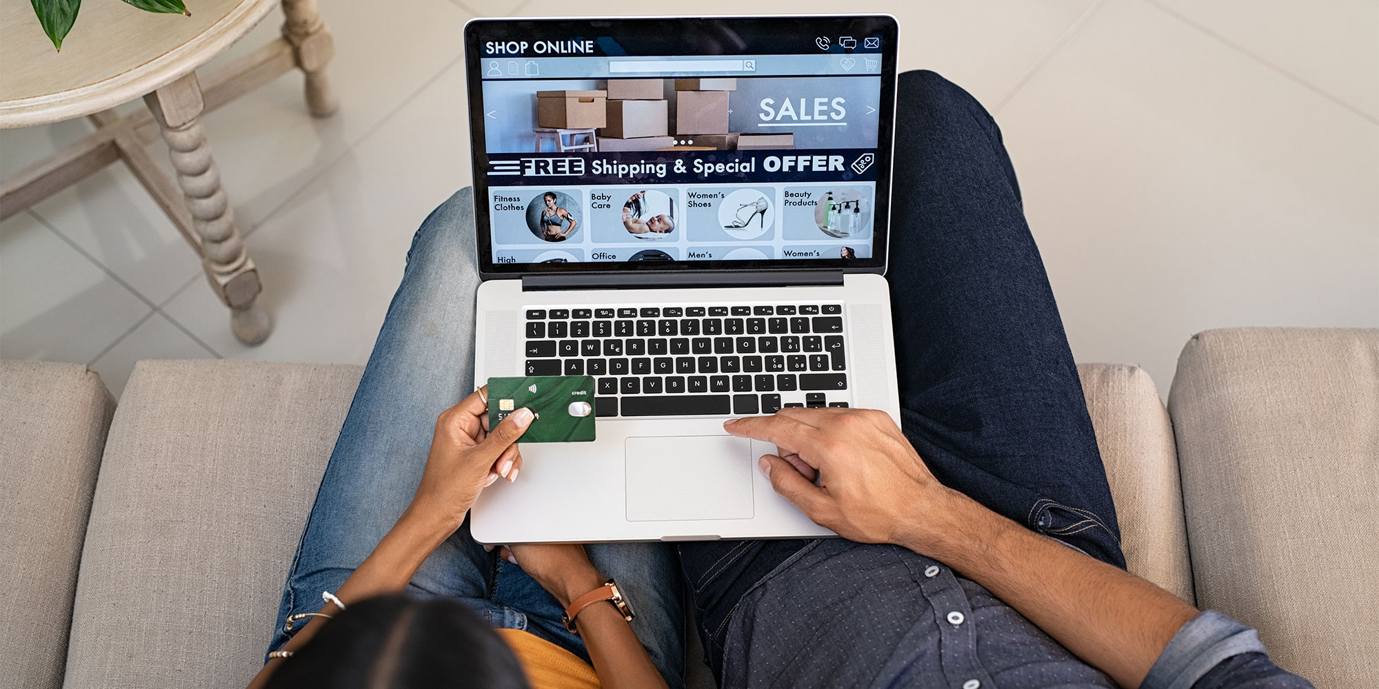Couple shopping online with a credit card