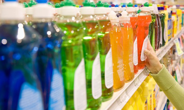 washing up liquids stacked on a supermarket shelf