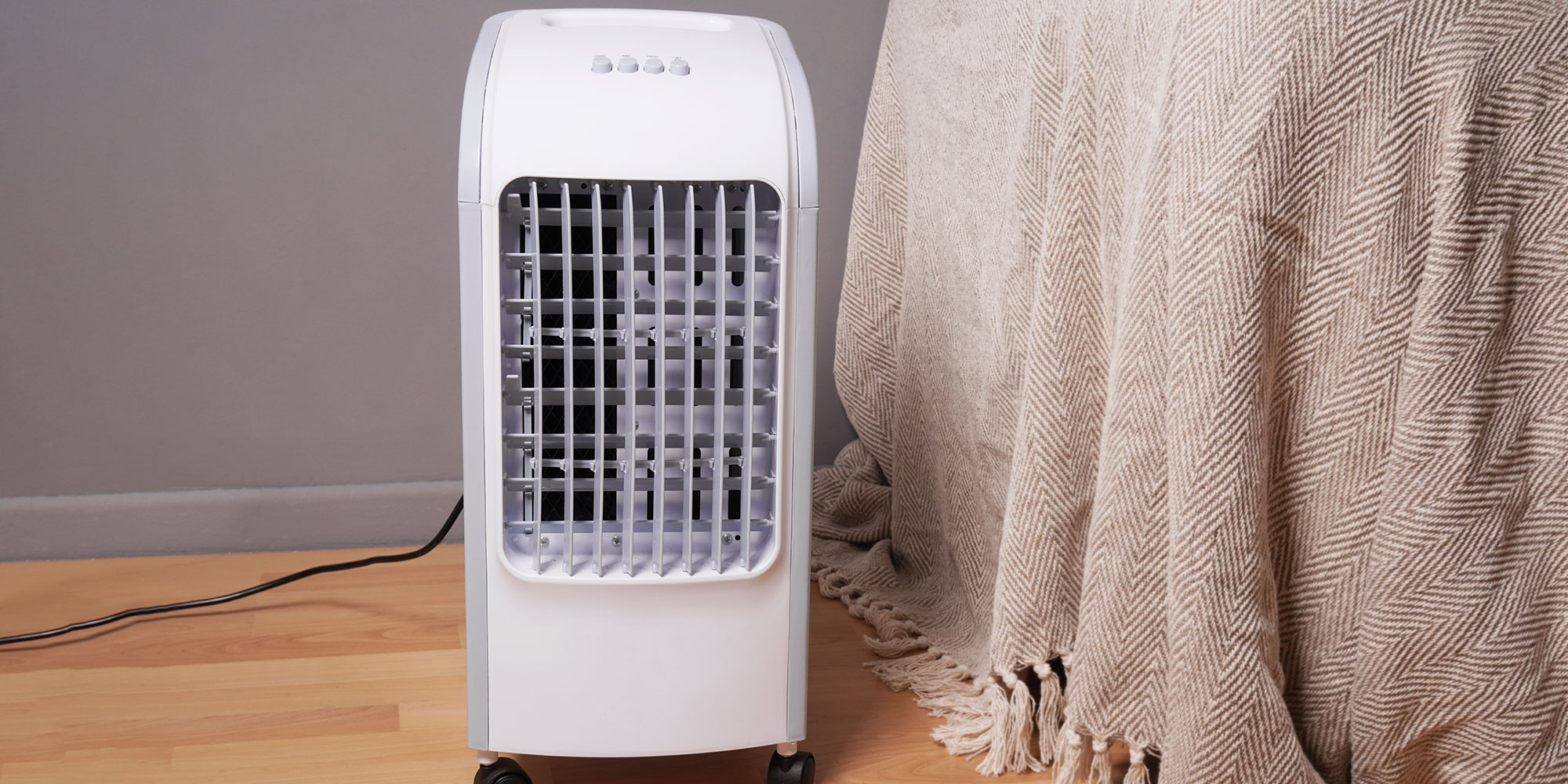 portable air conditioner next to bed