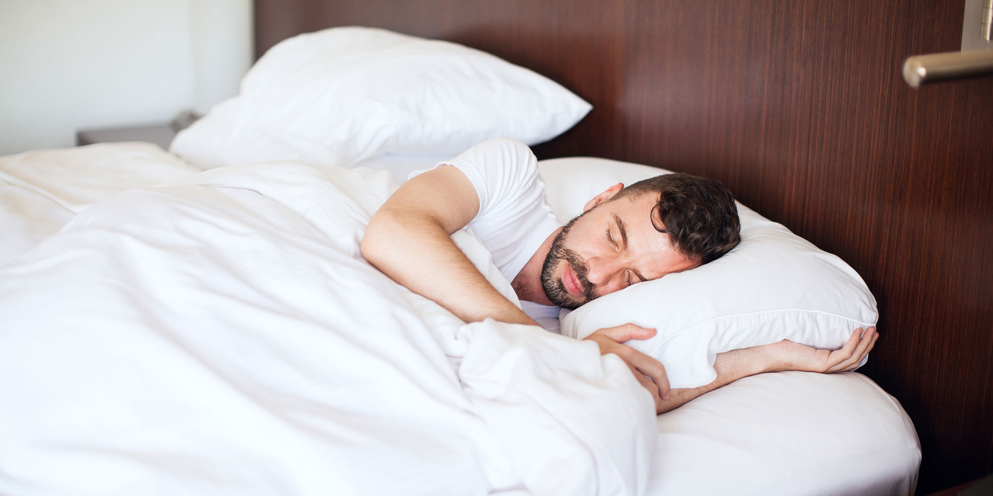Man sleeping in bed