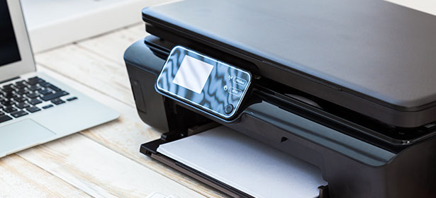 Printer next to laptop